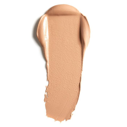 Lily Lolo Calico Cream Foundation: Warm tan with neutral & balanced undertones. Vegan. Gluten Free. GMO Free. Cruelty Free.  Infused with nourishing jojoba and argan oils.