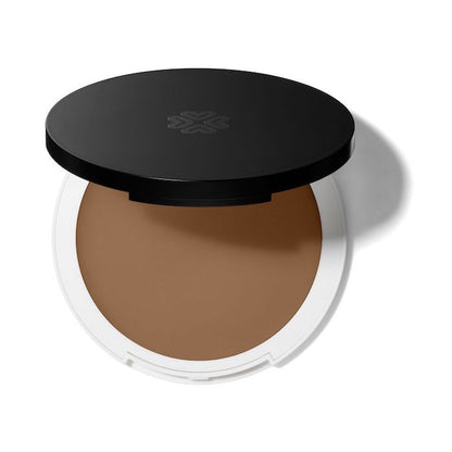 Lily Lolo Calico Cream Foundation: Warm tan with neutral & balanced undertones. Vegan. Gluten Free. GMO Free. Cruelty Free.